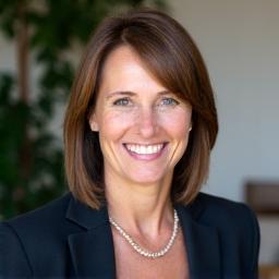 Professional headshot of Dr. Harriet Shaw, Founder & Lead Career Strategist at Iron Compass.